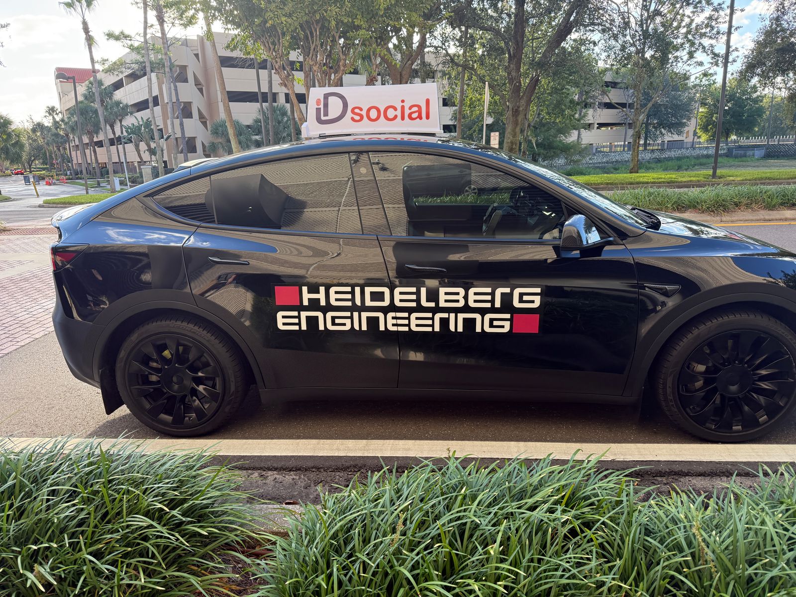 The iD Social EyeCab parked curbside between rides