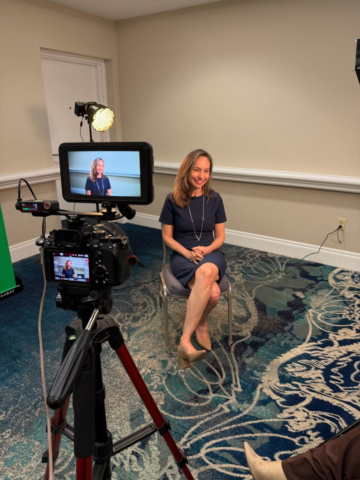 A physician being filmed for an interview